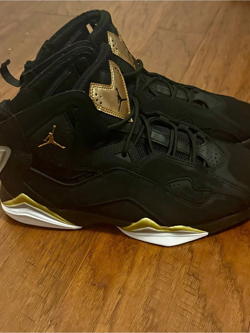 Jordan Black Basketball Sneakers with Gold Tongue Accents
